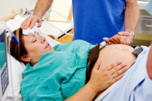 A woman prepares to give birth at a hospital.