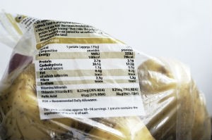 A bag of potatoes is shown with a nutrition label attached.