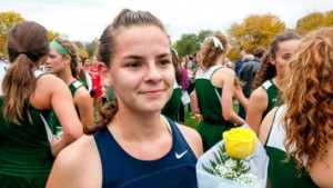 Gabrielle Alter poses for a photo in her cross country uniform.