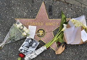 Leonard Nimoy's star from the Hollywood Walk of Fame is shown with flowers placed on it.