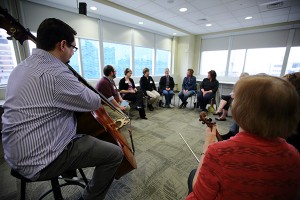 A music therapist performs during the Cancer Transitions program at Spectrum Health.