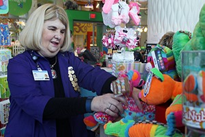 Cindi Walker organizes a group of toys.
