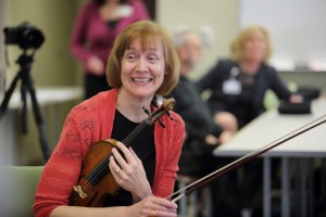 Diane Helle of the Grand Rapids Symphony Orchestra performs as part of the music therapy program at Spectrum Health.