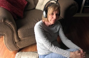 Karen Otto listens to music through her headphones.