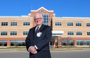Henry Veenstra poses for a photo in front of Spectrum Health Zeeland Community Hospital.