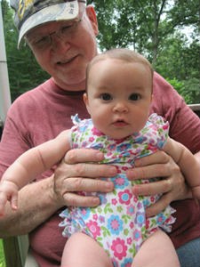 Tom Mix holds his granddaughter, Sophia.