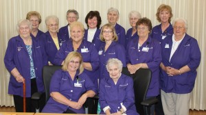 Spectrum Health Gerber Memorial volunteers are shown wearing purple jackets.
