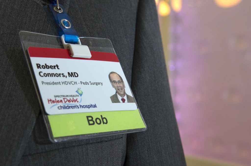Dr. Robert Connors, president of Spectrum Health Helen DeVos Children's Hospital, shows his nametag that says "Bob."