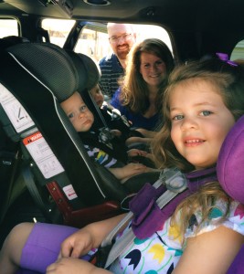 Olivia, Blake and Evan Smith sit in car seats and boosters.