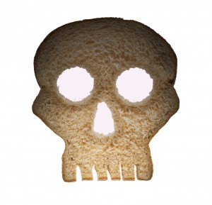 A piece of bread is carved into a skull.