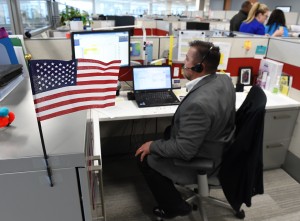 Army veteran David Decouto, a Spectrum Health recruiter, is shown at his desk.