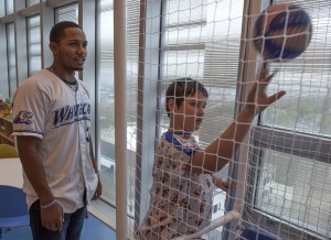 Helen DeVos Children’s Hospital patient Ryan Cowgill, 12, shoots hoops with West Michigan Whitecaps player Francisco Contreras Tuesday, May 12, 2015. (Chris Clark | Spectrum Health Beat)