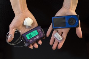 Sarah Halabu, a Spectrum Health Diabetes Educators, shows two glucose monitoring devices that are available for patients.