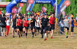 A group of runners run a race.