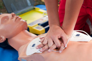 A person performs CPR on a Adult CPR Training Manikin.