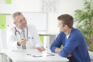 A man talks to his doctor about vasectomies.