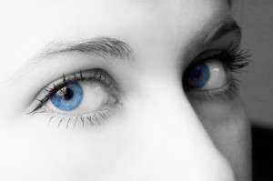 A woman's blue eyes are in focus.