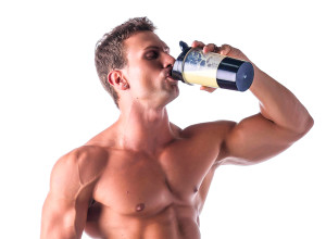 A fitness buff drinks a protein shake.
