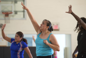 Isabel exercises during a cardio fitness class at the Roosevelt Park Lodge. (Chris Clark | Spectrum Health Beat)