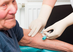 An elderly man gets an Alzheimer's blood test.