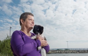 Linda McIntosh, 57, poses with her Pomeranian, Trinka Bell.