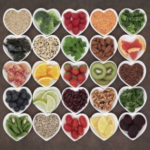 Twenty five heart-shaped bowls are shown holding different kinds of super foods.