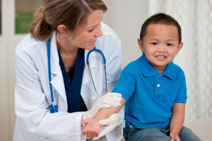 A young boy is tested for child pulmonary hypertension by a medical professional.