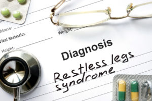 A diagnosis sheet reads, "Restless legs syndrome."
