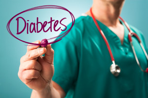 A medical professional writes "Diabetes" and circles the word.