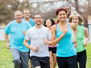 A group of people jog outside together.