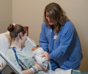 Trisha Plamondon, RN, assists Elizabeth Edel and her newborn baby, Amelia, at Spectrum Health Ludington Hospital's Family Birthing Center.