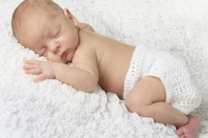 A baby is shown sleeping.