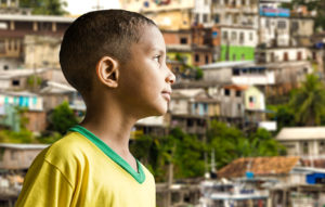 A young boy from Brazil poses for a photo.