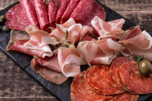 A plate is shown with cured meats.