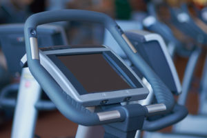A stationary bike is in focus.