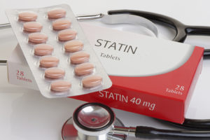"Statin tablets" are in focus.