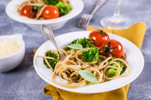 Two bowls with whole grain pasta are shown.