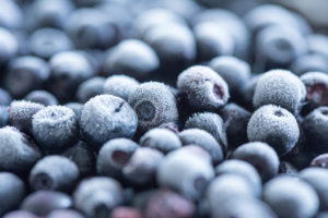 Frozen blueberries are in focus.