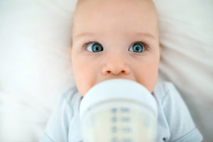 A baby drinks breast milk.