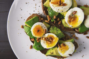 Toast with avacado and egg on it.