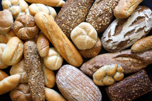 Whole-grain breads are in focus.