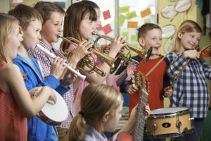 Kids play instruments in an in-school music program.