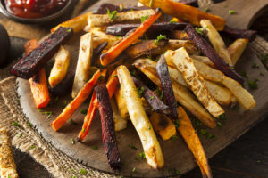 Carrot fries are in focus.