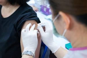 A person is getting the flu vaccine.