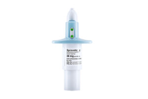 A nose spray vial of Spravato, with white bottom and sky blue-tipped cap are shown on white background.