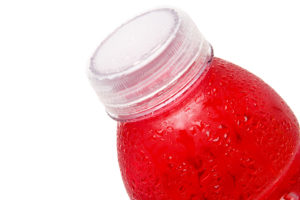 A red-colored energy drink is shown.
