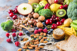 High fiber foods are shown, including almonds, pasta and various fruits and vegetables.