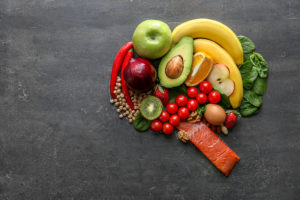 Fruits and vegetables are placed together in the shape of a brain.