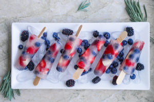 Homemade fruit and coconut water popsicles are shown.