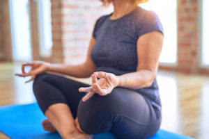 A person meditates during their yoga practice.